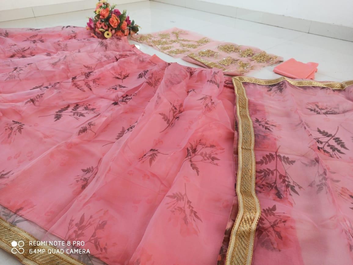 Baby pink organza printed lehenga with heavy work blouse