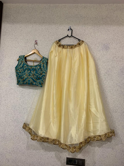 Beautiful cream soft net embroidered ceremonial lehenga choli