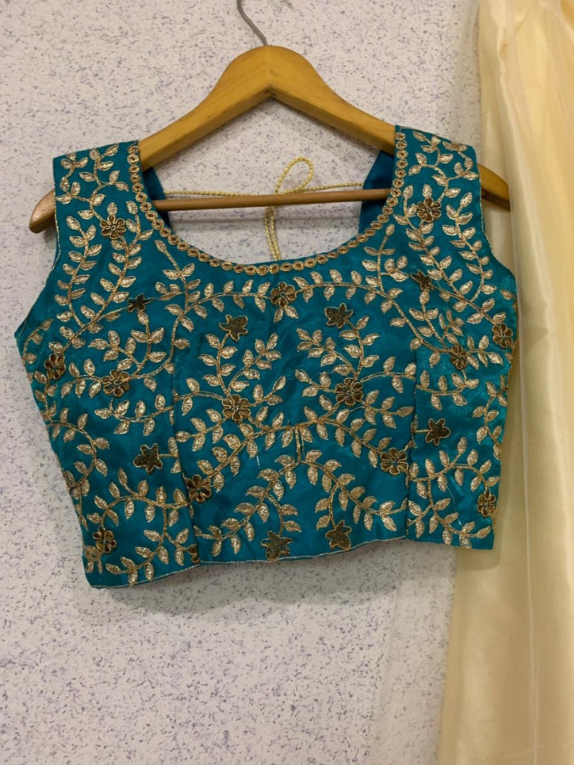 Beautiful cream soft net embroidered ceremonial lehenga choli