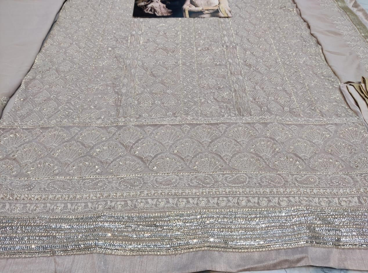 Beige faux georgette sequence embroidered work plazzo suit