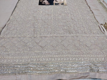 Beige faux georgette sequence embroidered work plazzo suit