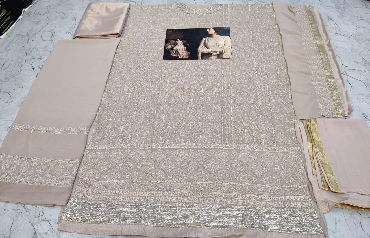 Beige faux georgette sequence embroidered work plazzo suit