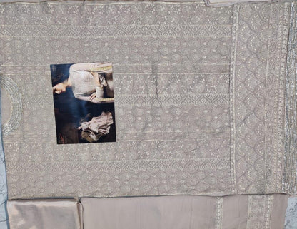 Beige faux georgette sequence embroidered work plazzo suit