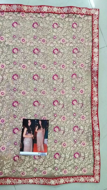 Beige mono net heavy embroidered ceremonial saree