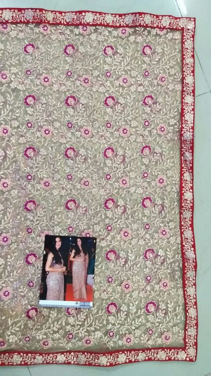 Beige mono net heavy embroidered ceremonial saree