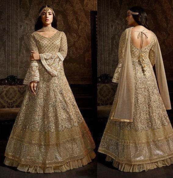 Beige net heavy embroidered designer wedding gown with dupatta