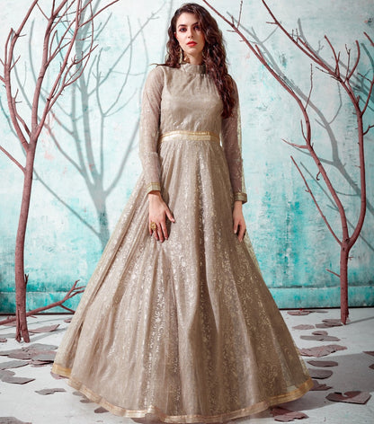 Beige net metallic foil work party wear designer gown