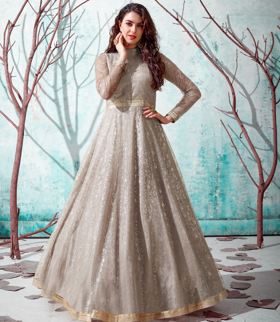 Beige net metallic foil work party wear designer gown