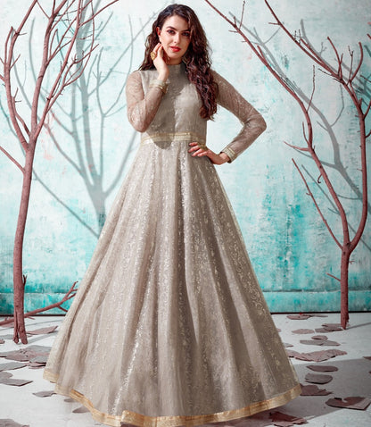 Beige net metallic foil work party wear designer gown