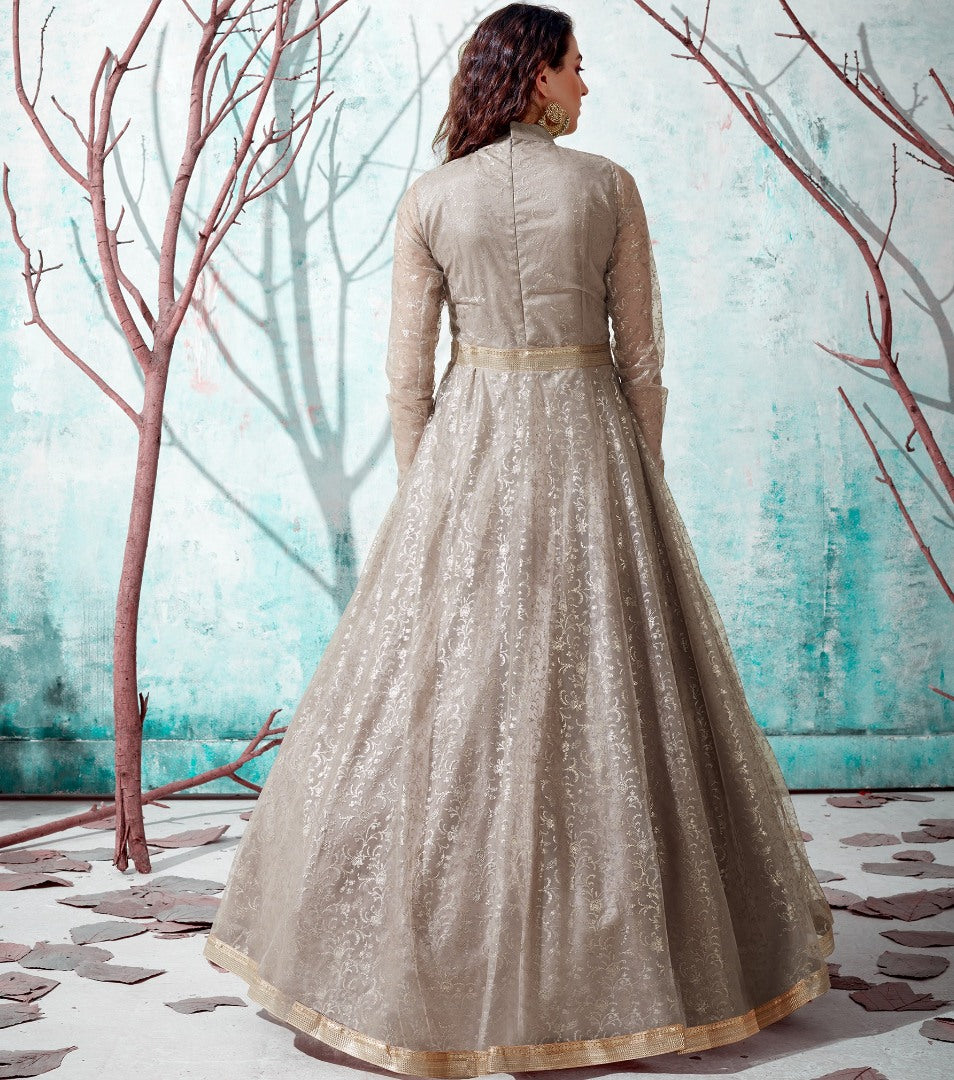Beige net metallic foil work party wear designer gown