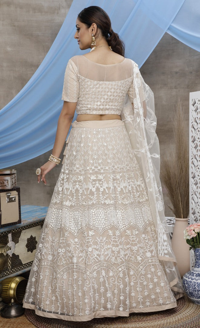 Beige net sequence embroidered party wear lehenga choli