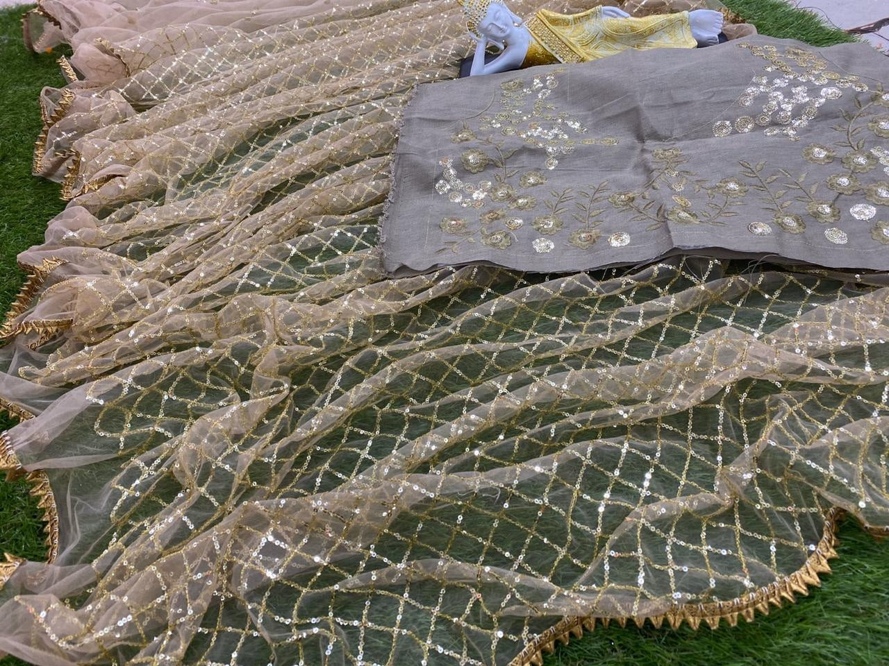 Beige net with heavy sequence work wedding saree