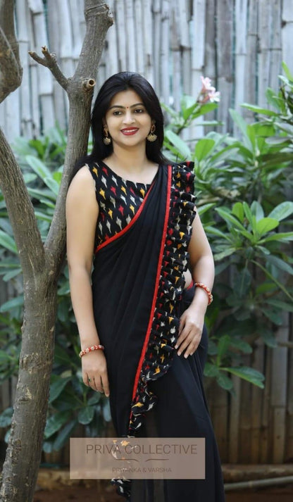 black georgette partywear saree with printed ruffle border