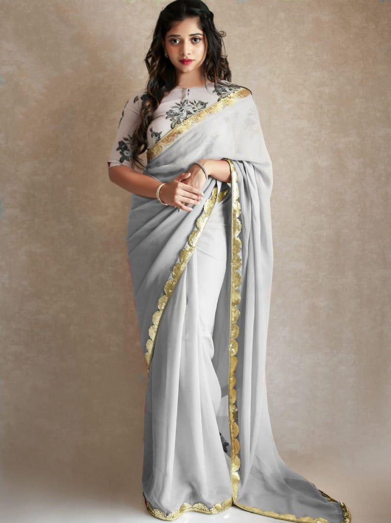 Black georgette partywear saree with sequence work gold border