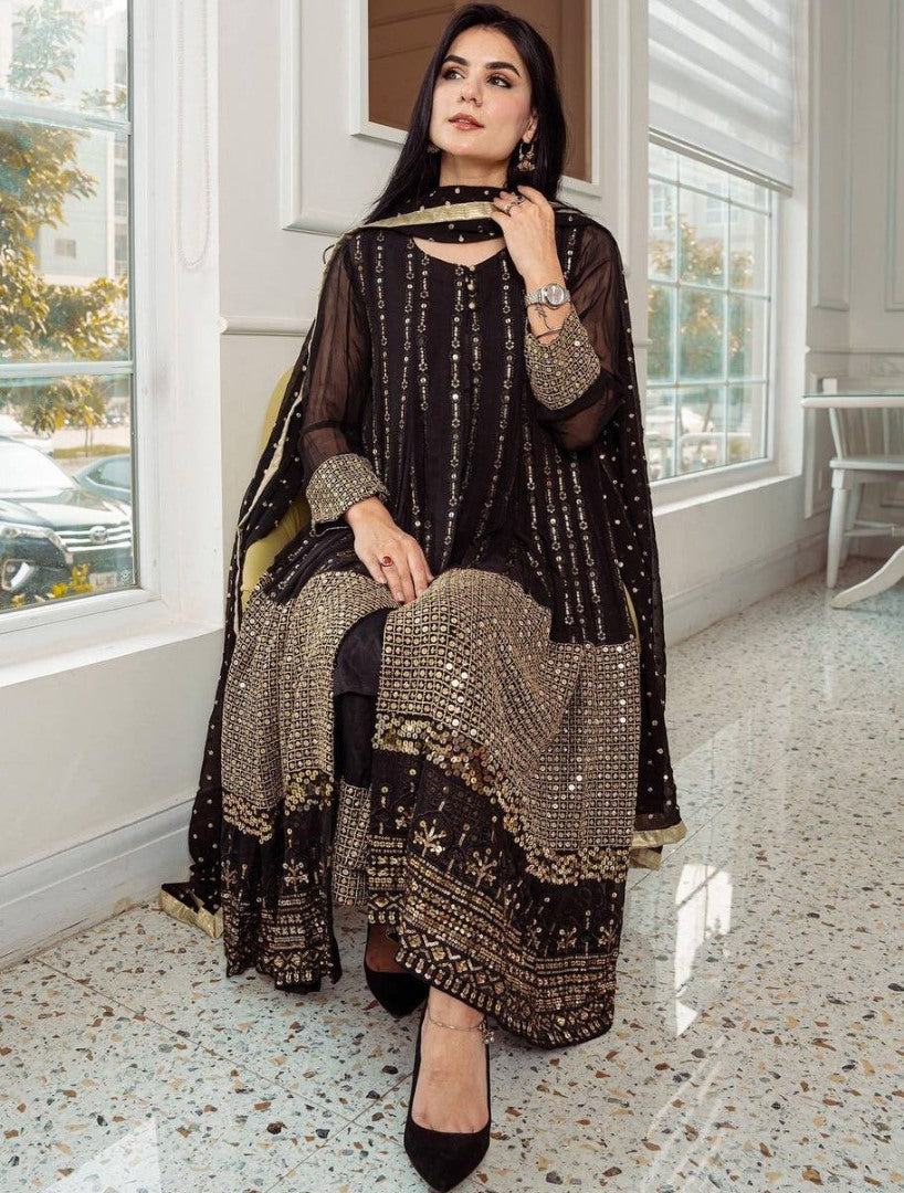 Black heavy embroidery worked salwar suit with shrug