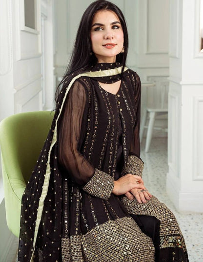 Black heavy embroidery worked salwar suit with shrug