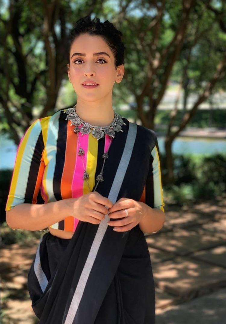 Black moss satin partywear saree with multicolored blouse