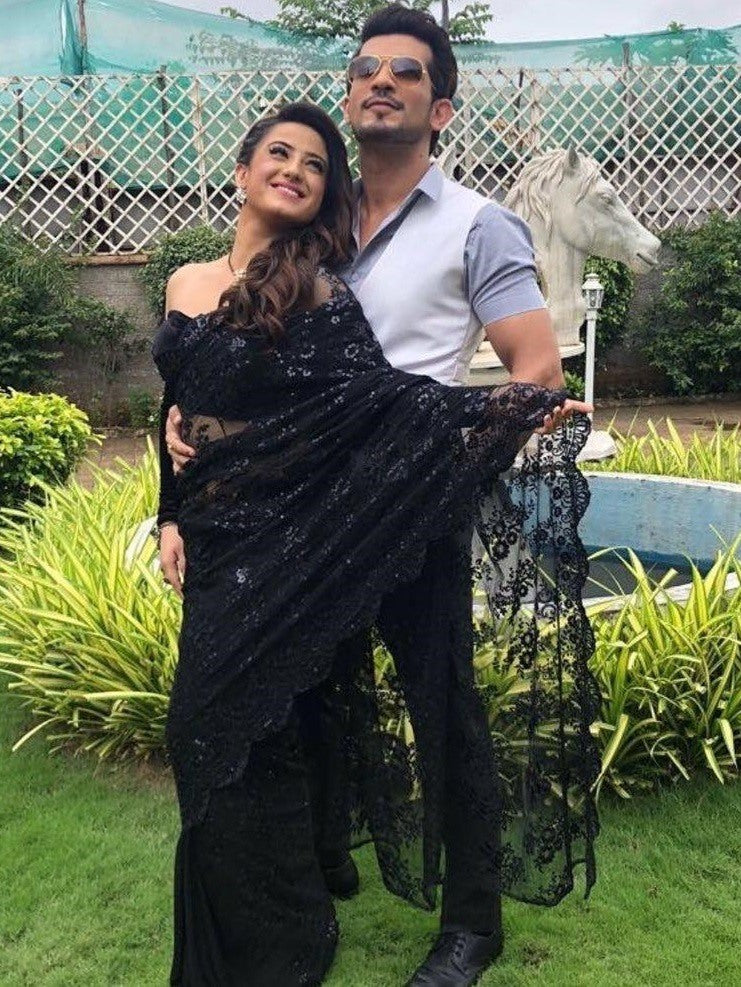 Black net heavy embroidered saree