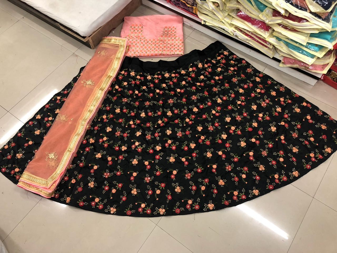 Black tapeta silk multi colored embroidered lehenga choli