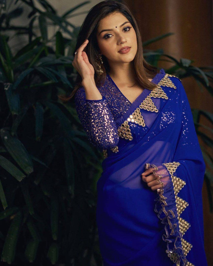 Blue georegette thread sequence and foil mirror work ruffle saree