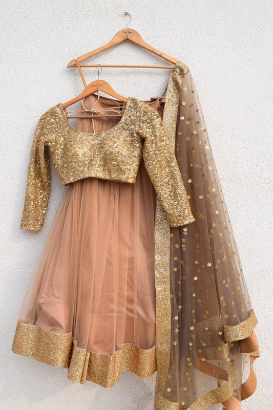 Brown net sequence worked ceremonial lehenga choli