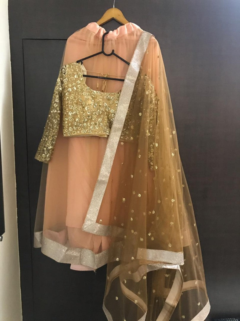 Brown net sequence worked ceremonial lehenga choli