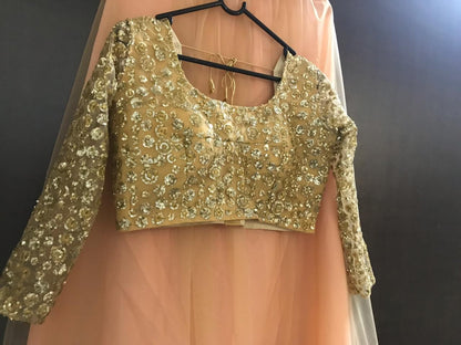 Brown net sequence worked ceremonial lehenga choli