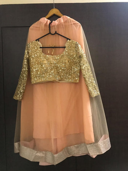 Brown net sequence worked ceremonial lehenga choli