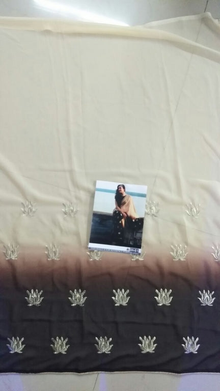 Cream and black embroidered partywear saree