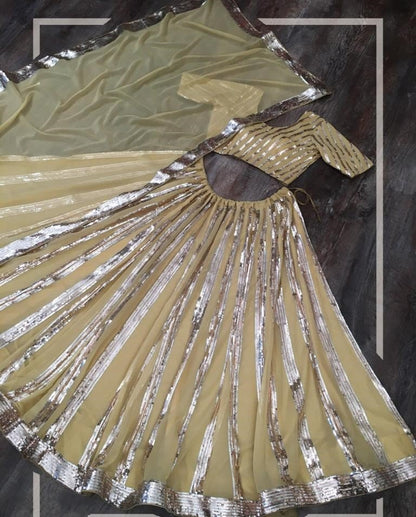 Cream blooming georgette sequence embroidered lehenga choli