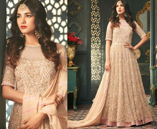 Cream Colored Net Heavy Embroidered Semi Stitched anarkali Suit