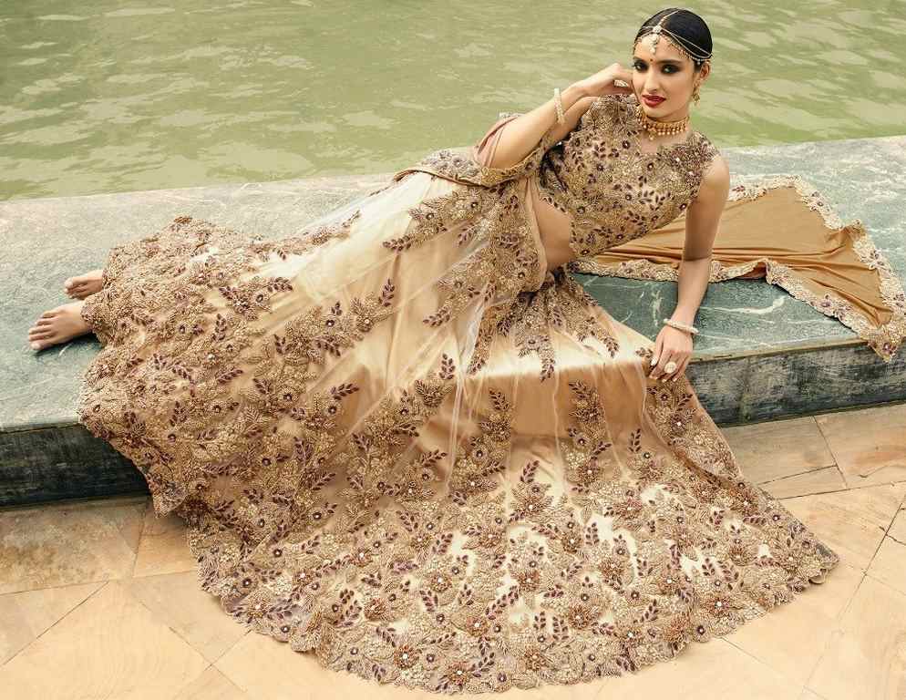 cream embroidered mono net wedding lehenga
