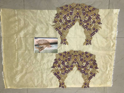 cream embroidered mono net wedding lehenga