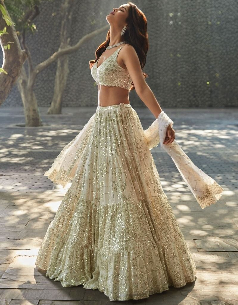 Cream georgette heavy sequins and thread work wedding lehenga choli