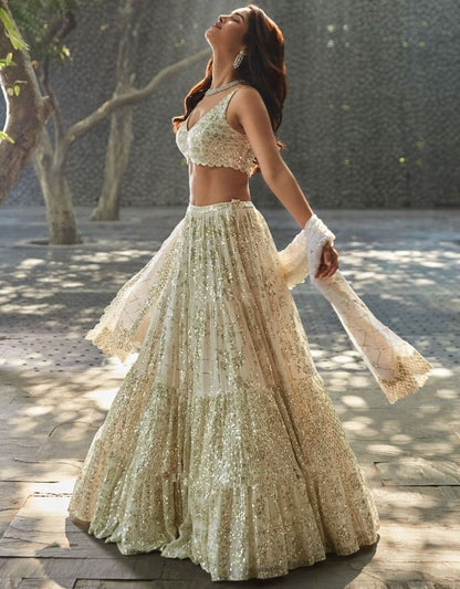 Cream georgette heavy sequins and thread work wedding lehenga choli