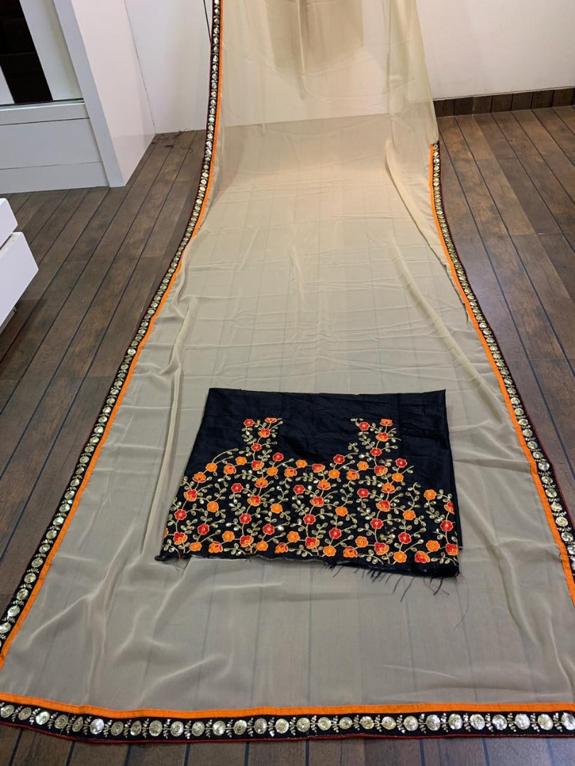 Cream georgette saree with heavy embroidered blouse