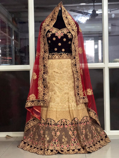 Cream heavy tapeta silk and velvet heavy embroidered bridal lehenga