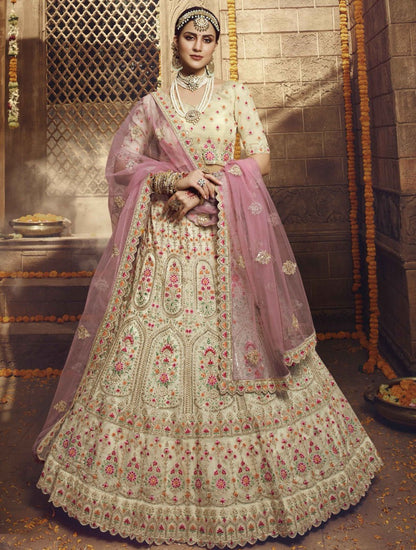 Cream organza thread zari and stone work bridal lehenga choli