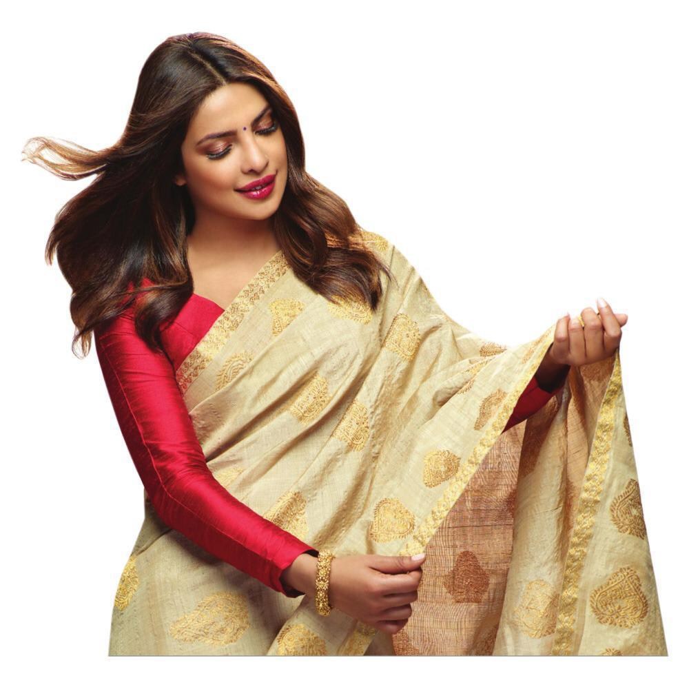 Cream zarna silk saree with red tassels