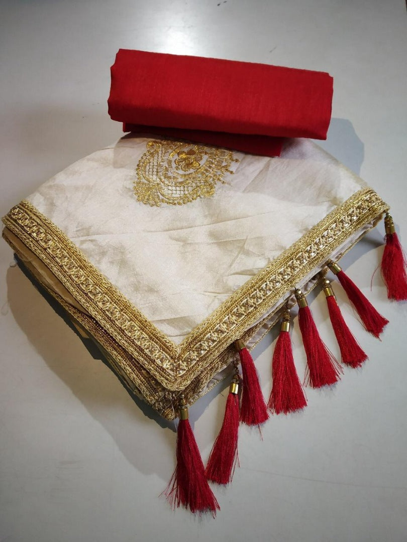 Cream zarna silk saree with red tassels