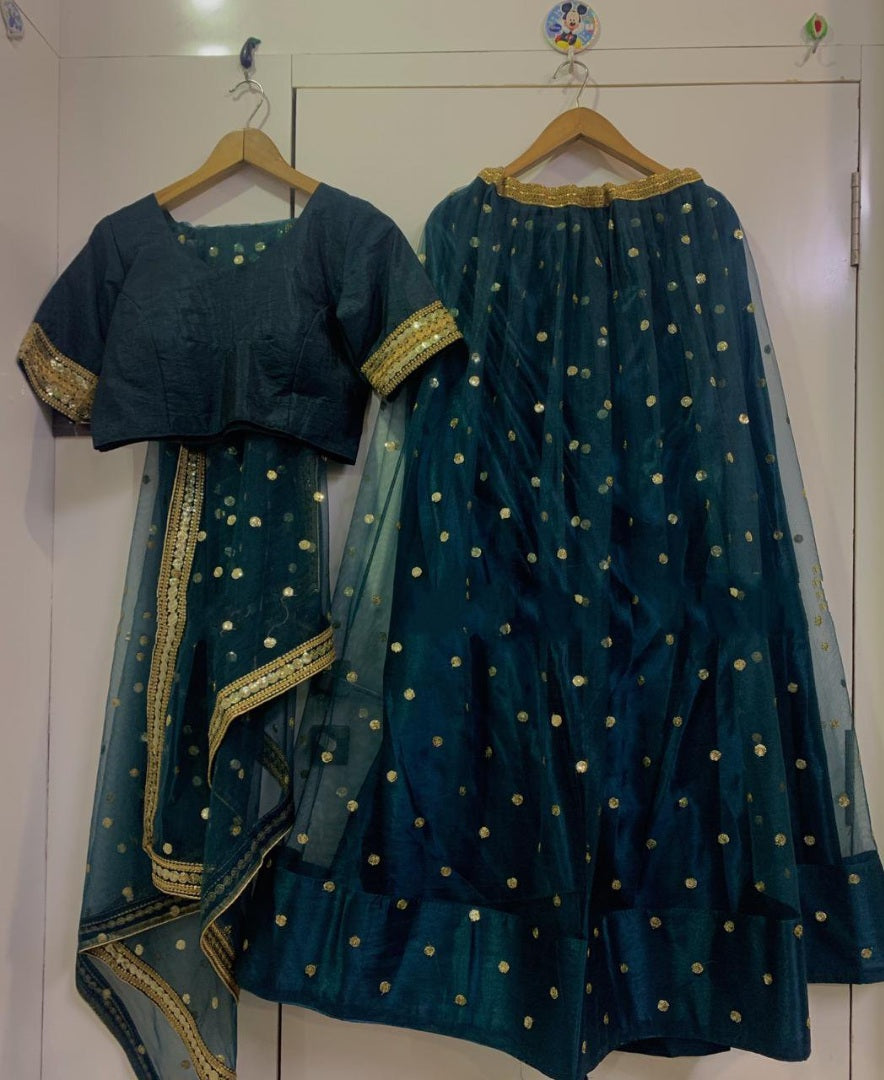 Dark green net wedding lehenga choli