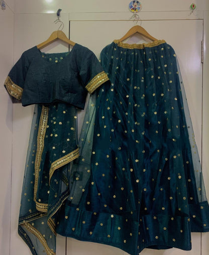Dark green net wedding lehenga choli
