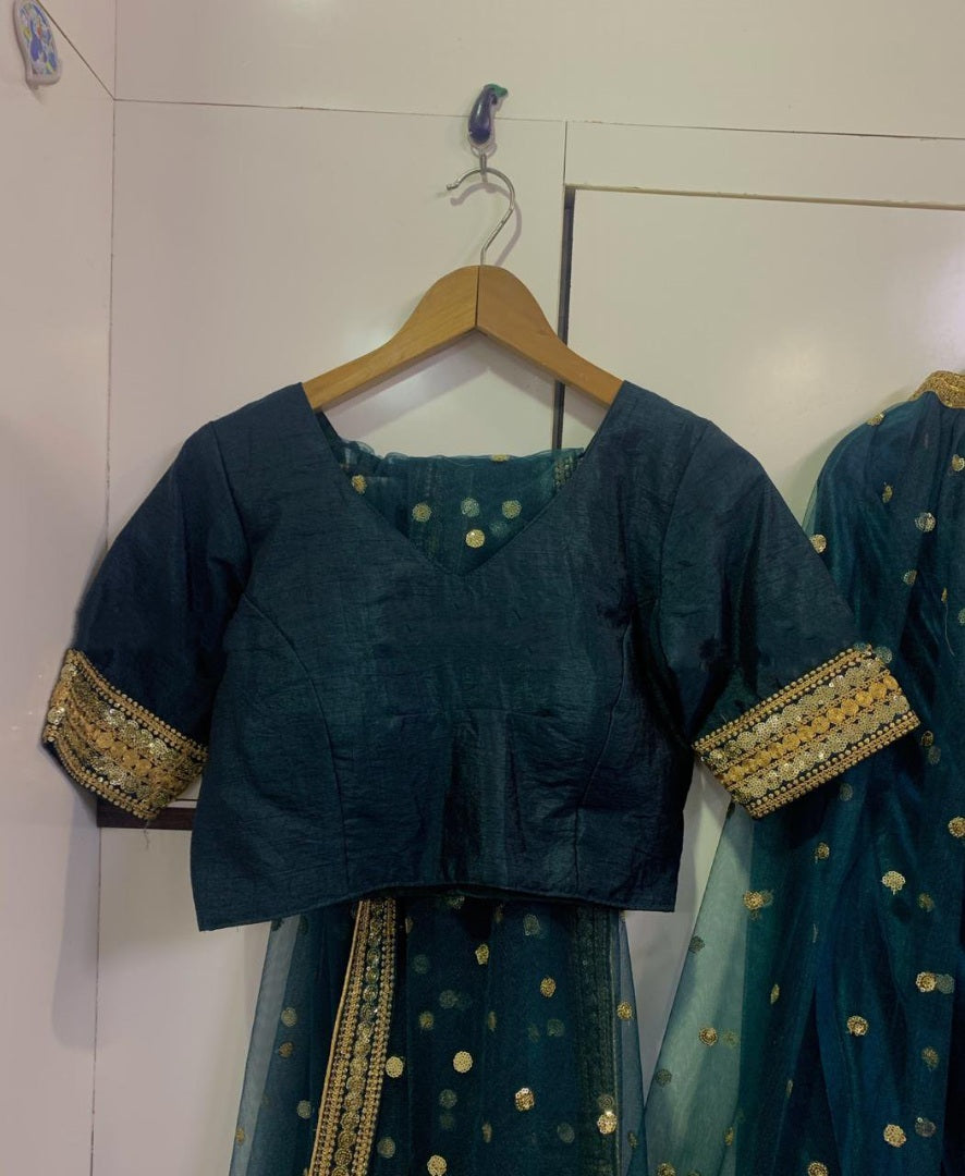 Dark green net wedding lehenga choli