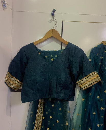 Dark green net wedding lehenga choli
