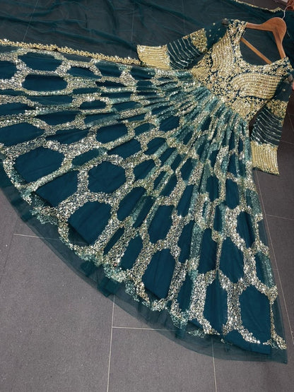 Dark green soft net heavy sequence embroidered party wear gown