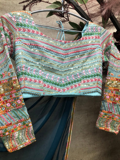 Dark rama designer georgette party wear saree with stitched blouse