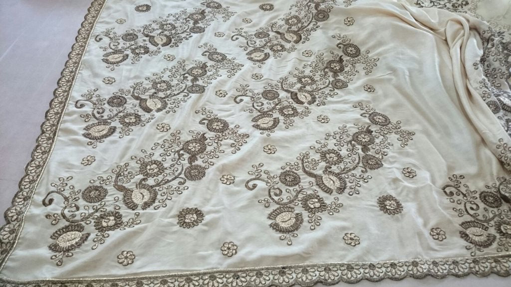 Designer cream embroidered ceremonial saree