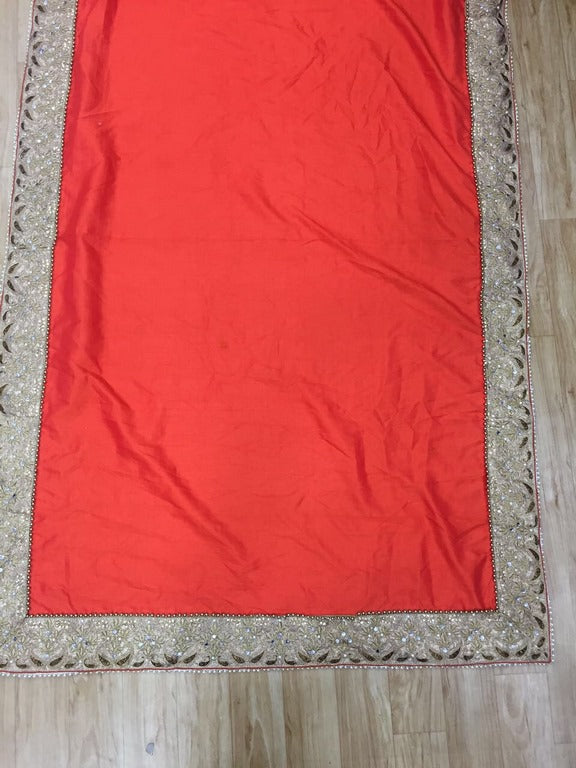 Designer embroidered orange wedding saree