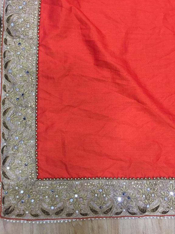 Designer embroidered orange wedding saree