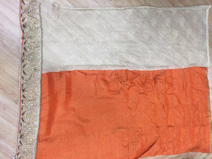 Designer embroidered orange wedding saree